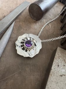 large geometric silver pendant set the faceted amethyst with a handmade silver chain